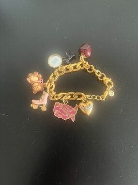 Juicy Couture Gold Tone Charm Bracelet with Pink and Red Accents